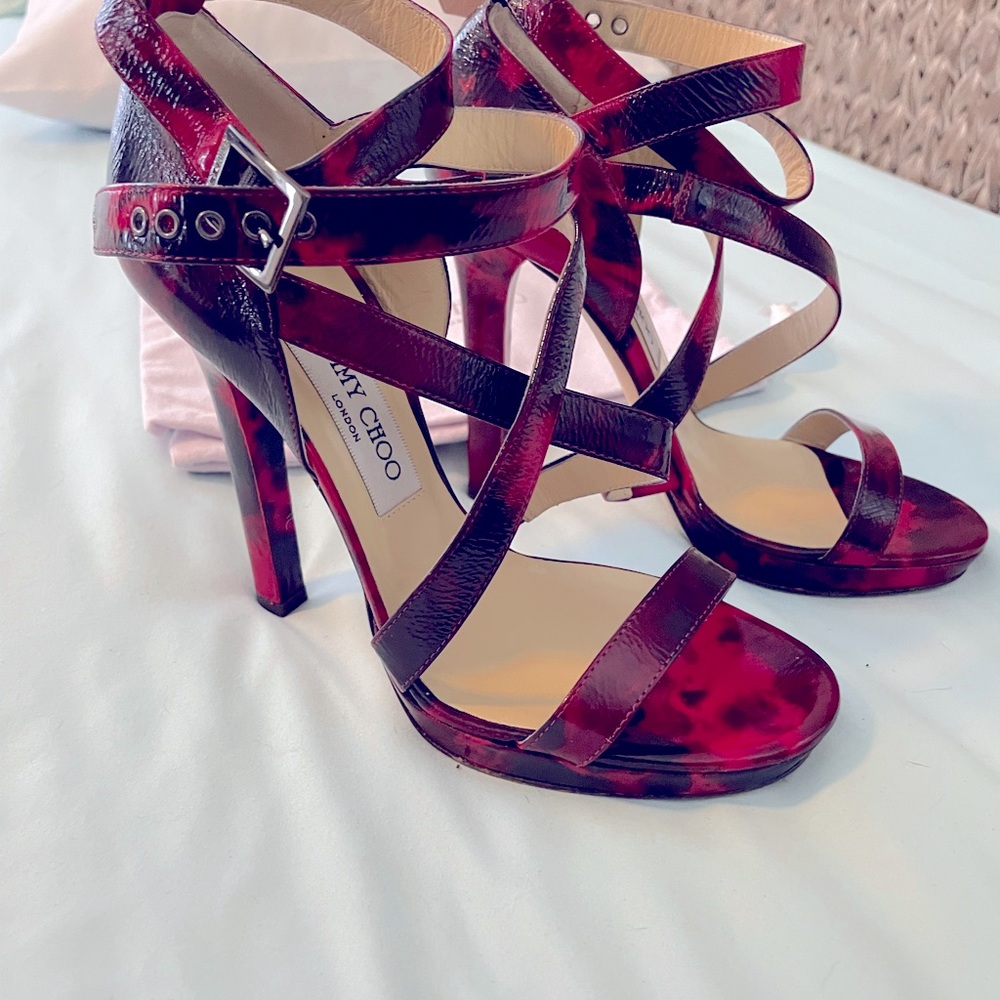 Jimmy Choo heels. Black and red leather. Ankle strap. Never worn